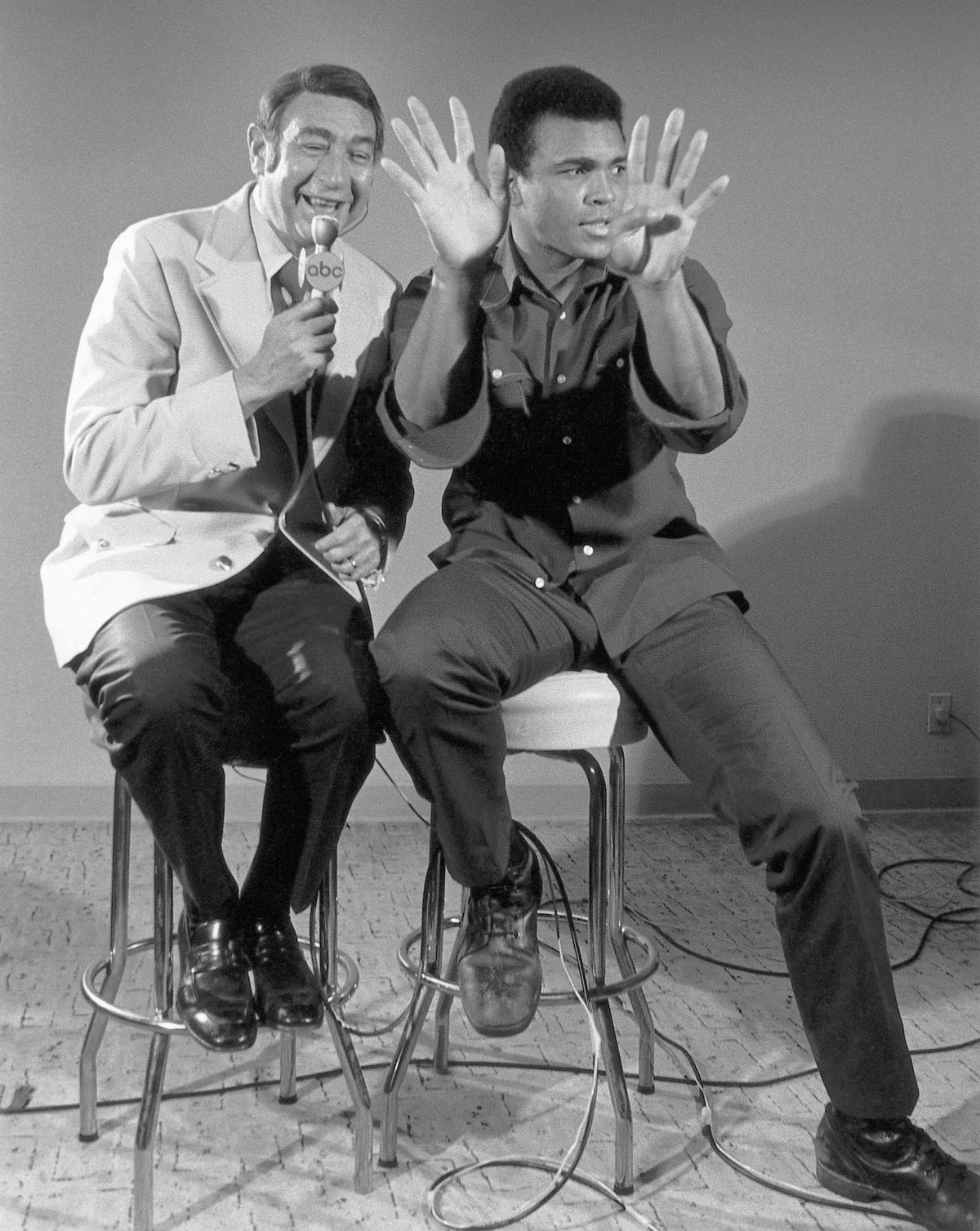 Muhammad Ali with Howard Cosell (Ali with Both Hands Up)