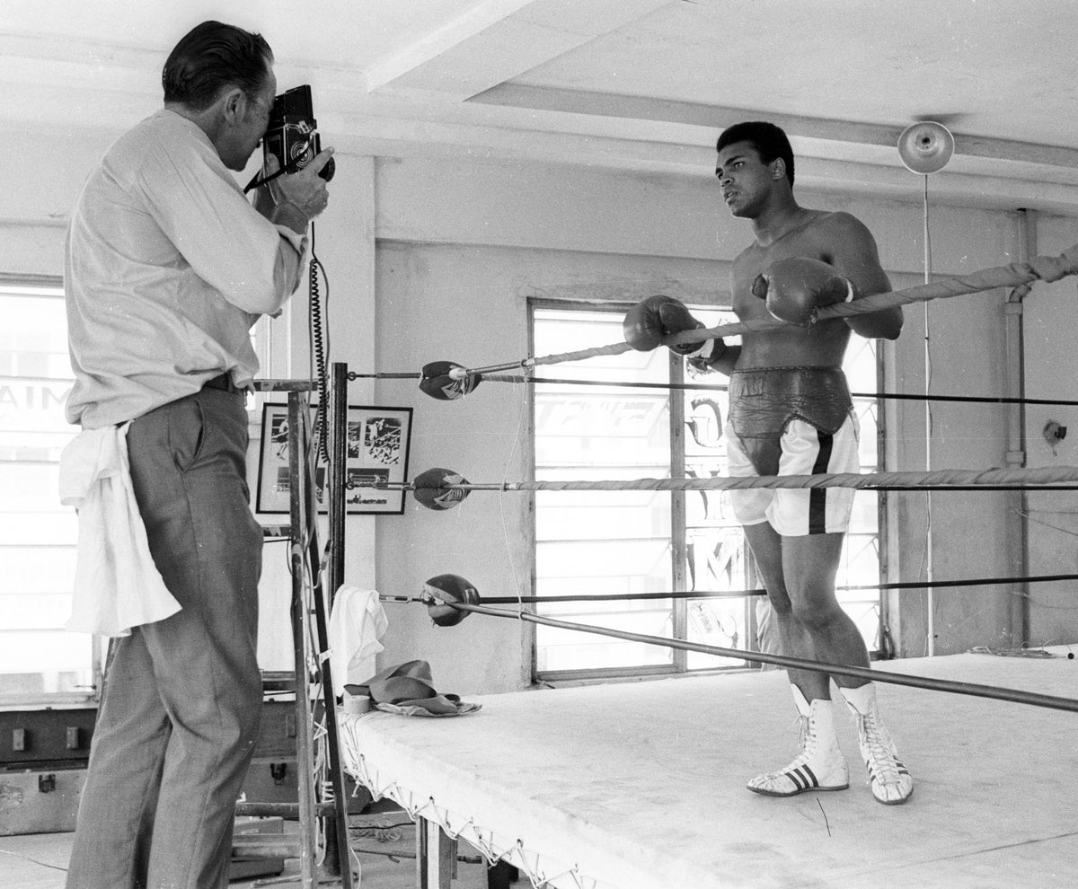 Muhammad Ali at Training Camp Posing for Photographer