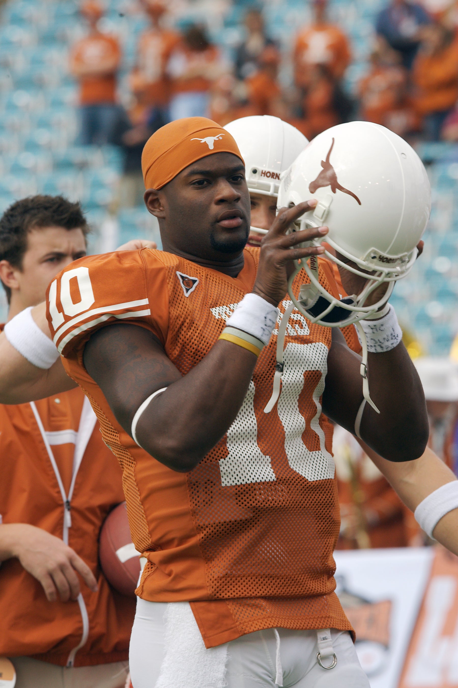 Vince Young Putting on Helmet